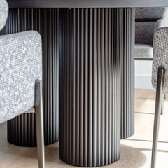 1.5-meter round dining table with rich wood grain ash veneer and minimalist black finish – designed for stylish dining spaces.