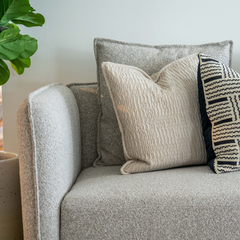 Contemporary L-shaped sofa with plush fabric upholstery and sleek metal legs, ideal for stylish modern interiors.