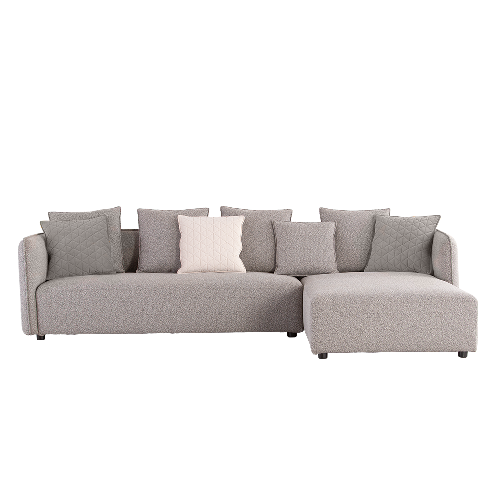 Designer L-shaped corner sofa with soft fabric upholstery, intricate arm detailing, and sturdy hardwood and metal base.