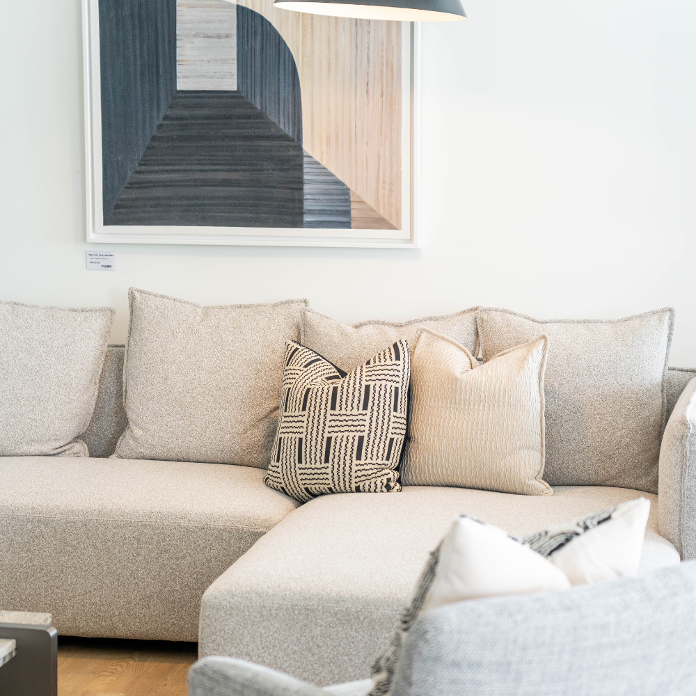 Luxury L-shaped living room sofa in soft fabric with durable hardwood and metal frame, perfect for modern homes.