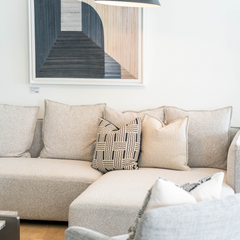 Luxury L-shaped living room sofa in soft fabric with durable hardwood and metal frame, perfect for modern homes.