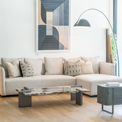Modern sectional lounge sofa with soft fabric upholstery, generous seating, and sturdy hardwood and metal base for luxury comfort.