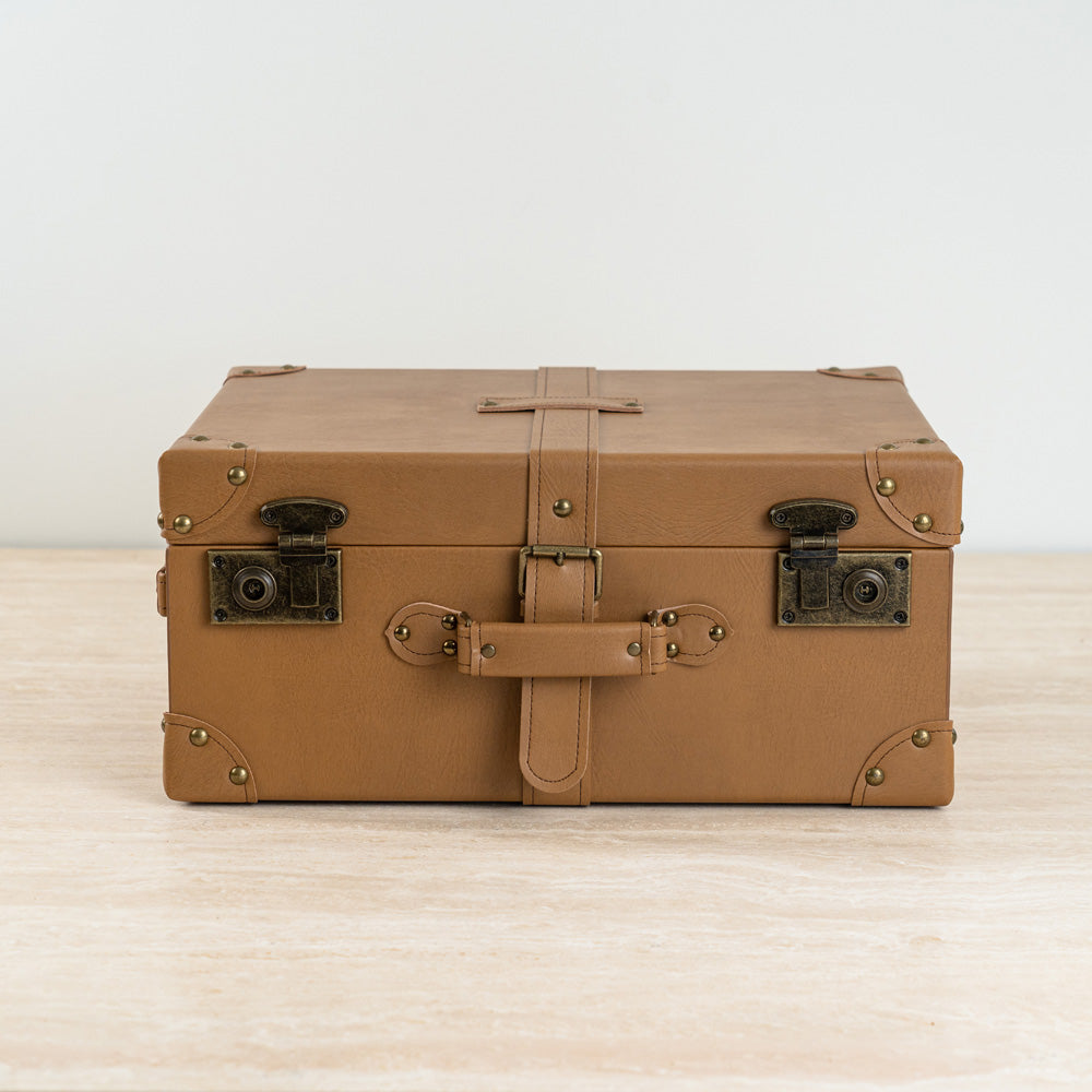 Tan leather-look Dante storage box with suitcase-style design for stylish home organization.
