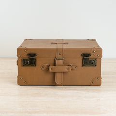 Tan leather-look Dante storage box with suitcase-style design for stylish home organization.