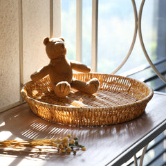 Decorative round plate-style storage basket, lightweight yet durable, blending functionality with elegant home décor.