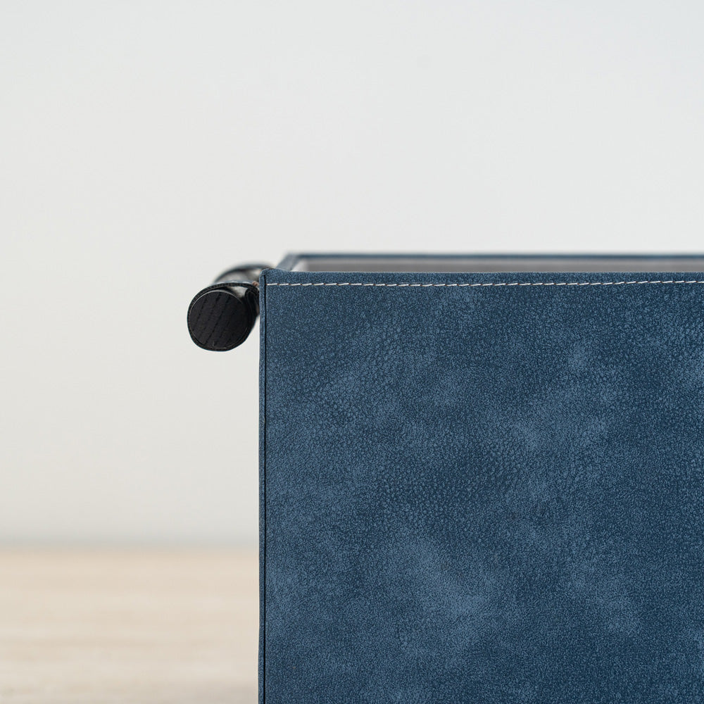 Stylish storage organizer featuring a navy and cream color combination.