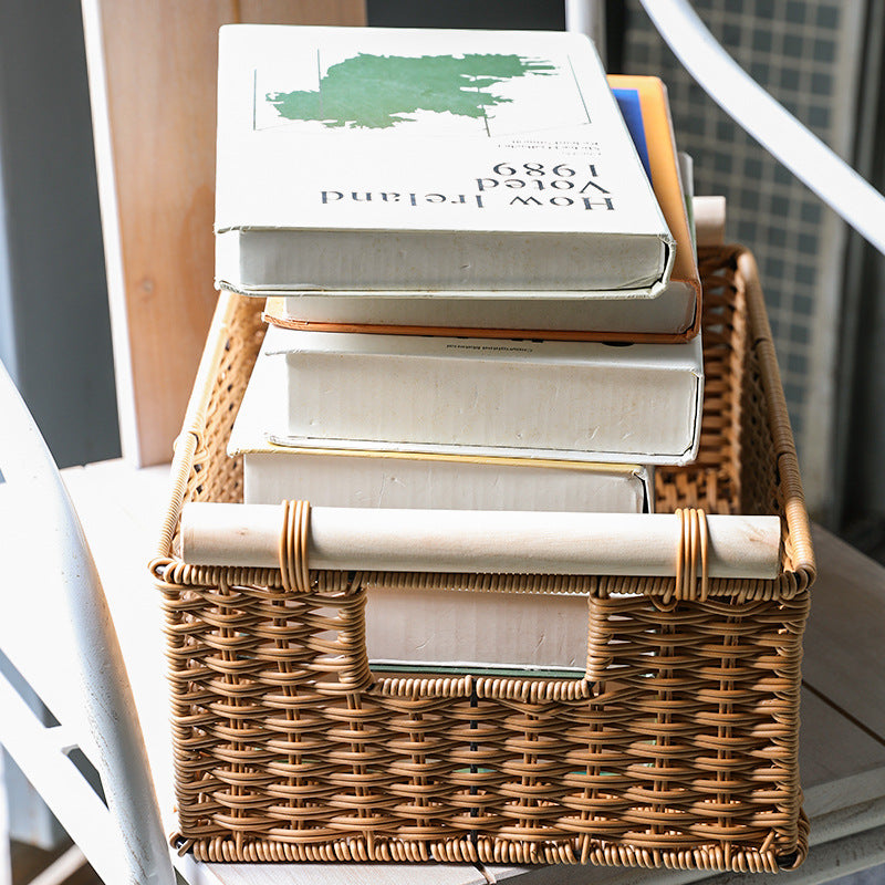 Durable rectangular plastic rattan basket with wooden handles, versatile for kitchen, bathroom, or office organization.