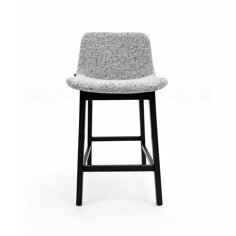 Classic bar stool upholstered in soft grey fabric with dark ash wood legs, ideal for kitchen islands and modern bar areas.