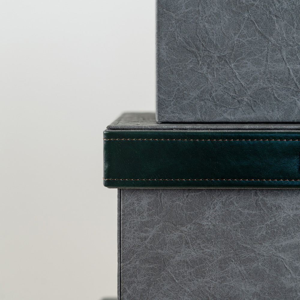 Dark grey and green decorative storage box that enhances contemporary décor.