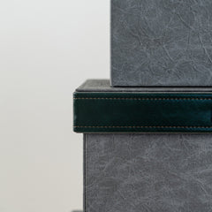 Dark grey and green decorative storage box that enhances contemporary décor.