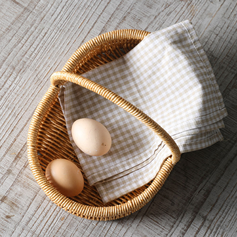 Elegant shallow oval basket with a single handle, ideal for organizing toiletries, accessories, or small household essentials.