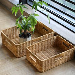 Elegant rectangular plastic rattan storage box with handle, combining practicality and timeless design for home organization.