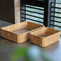 Elegant rectangular storage basket crafted from plastic rattan, perfect for toiletries, pantry items, or stylish decorative accents.