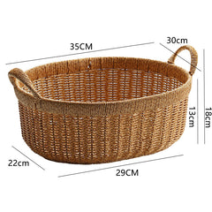 Essential oval plastic rattan basket with sturdy handles, perfect for home storage, accessories, or décor.