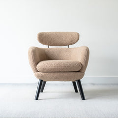 Ettore armchair upholstered in faux sheepskin fabric with modern minimalist design