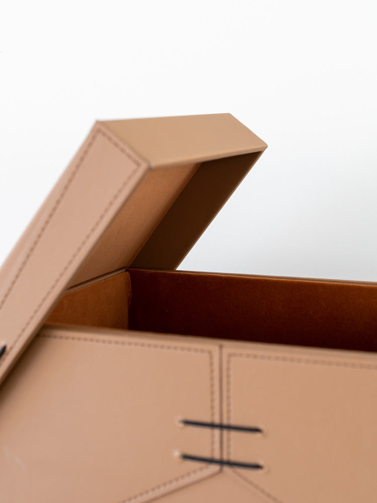 Stylish medium and large PU leather storage boxes with plush velvet interiors, perfect for storing valuables, office supplies, or decorative items in contemporary and luxury home spaces.