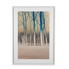 A framed art print depicting a winter forest scene with tall white birch trees and blue trunks against a warm beige sky, presented in a white frame with a white mat.