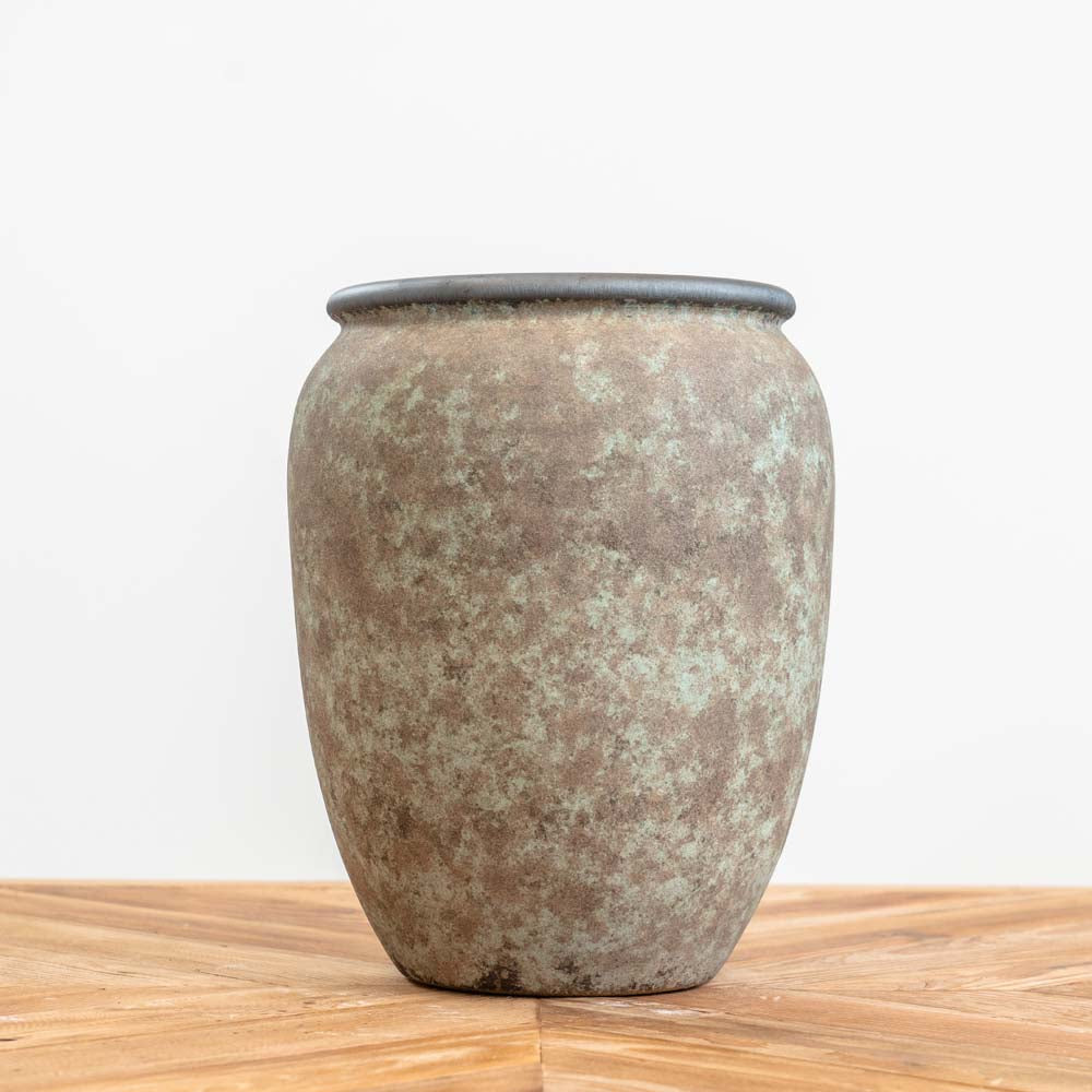 Small handcrafted Geneva planter pot with green and turquoise hues, brown sponged detailing, and a drainage hole, suitable for indoor and outdoor use.