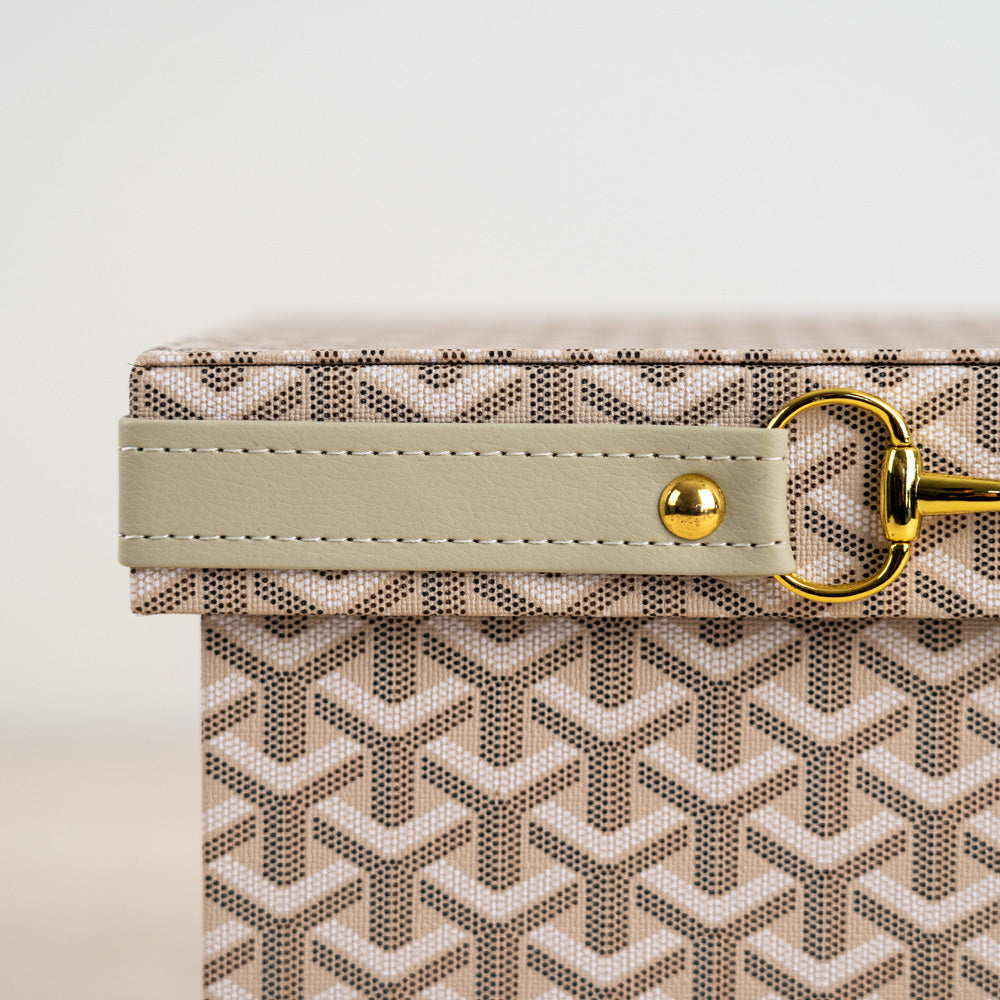 Sophisticated home organizer with woven texture and gold metal clasp.