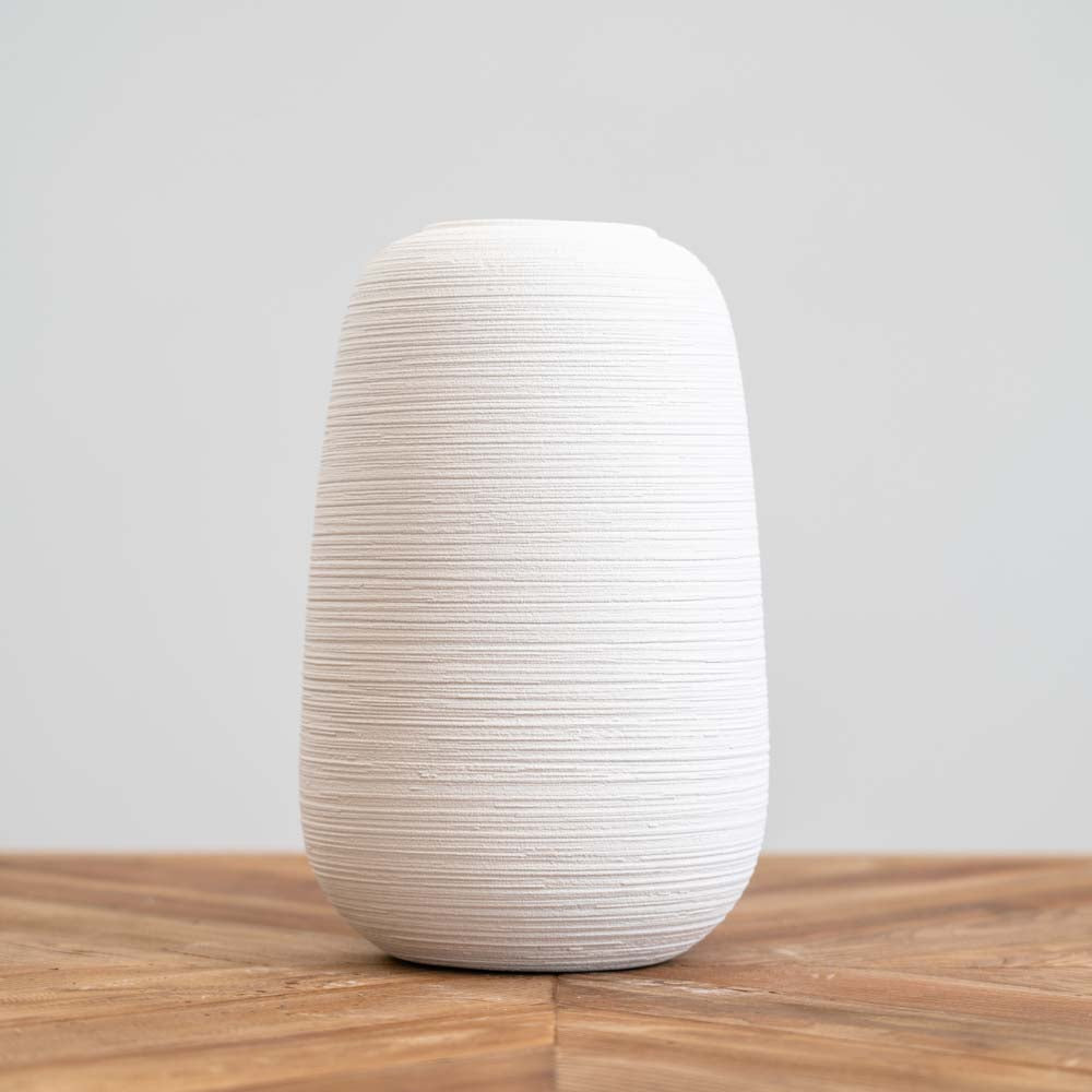 White ceramic Grafo Medium Vase with textured circular lines, perfect for modern home décor and floral arrangements.