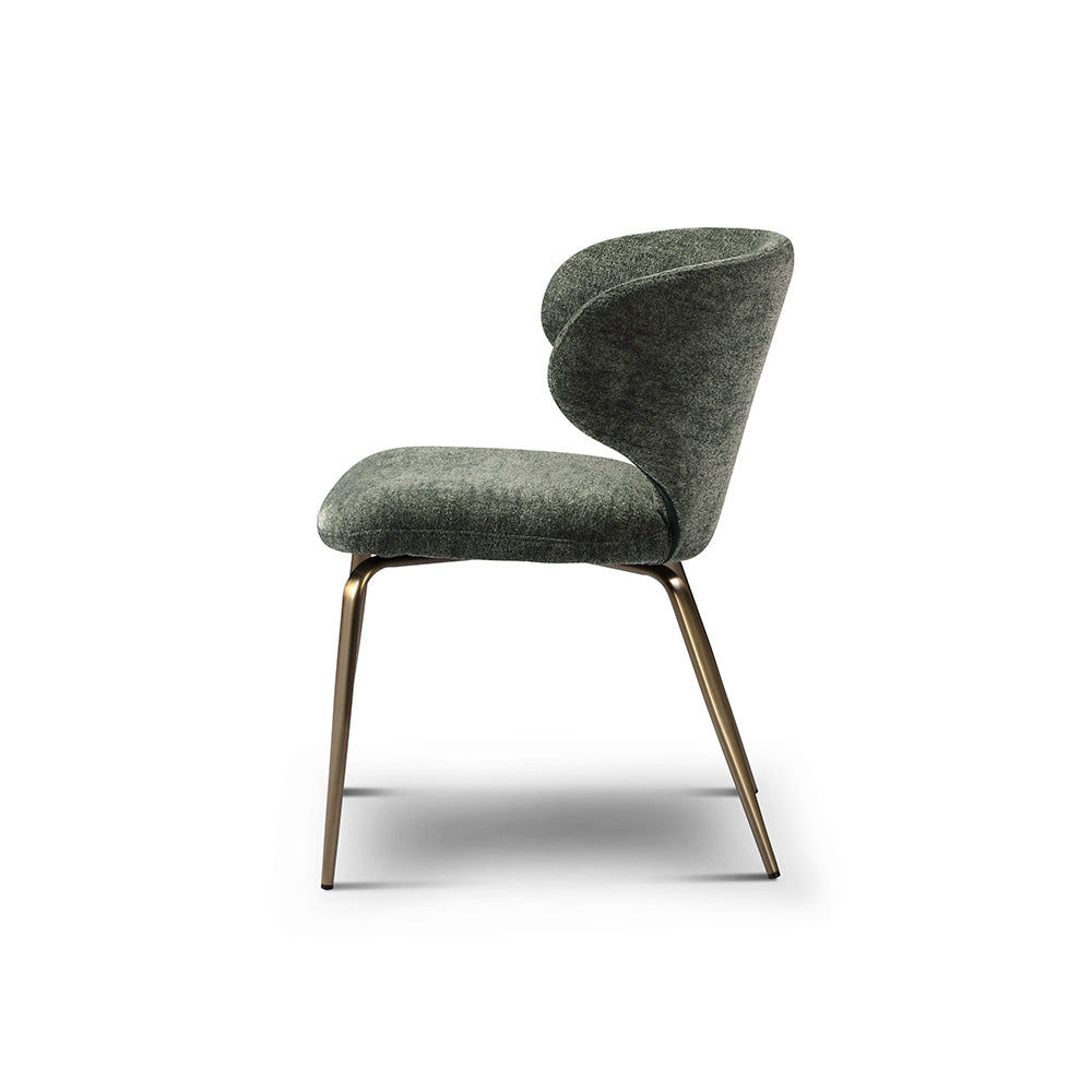 Elegant green upholstered dining chair with soft fabric seat and golden brass-finished legs, perfect for modern luxury interiors.