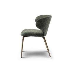 Elegant green upholstered dining chair with soft fabric seat and golden brass-finished legs, perfect for modern luxury interiors.