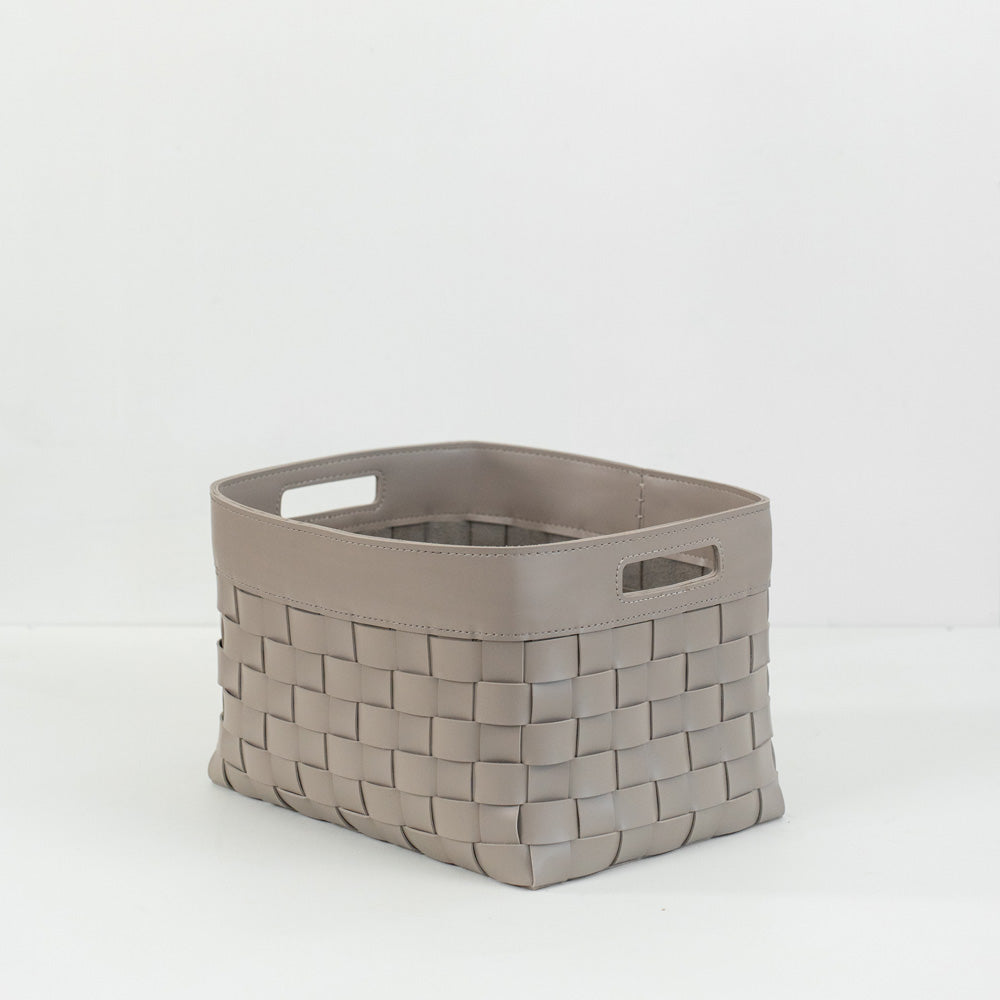 Elegant small storage box crafted from durable hand-woven bridle leather, ideal for organizing blankets, magazines, toys, or household essentials in modern and contemporary interiors.