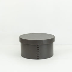 Stylish hand-woven bridle leather round box, offering practical storage and a sophisticated touch to living rooms, bedrooms, or offices in contemporary and minimalist spaces.