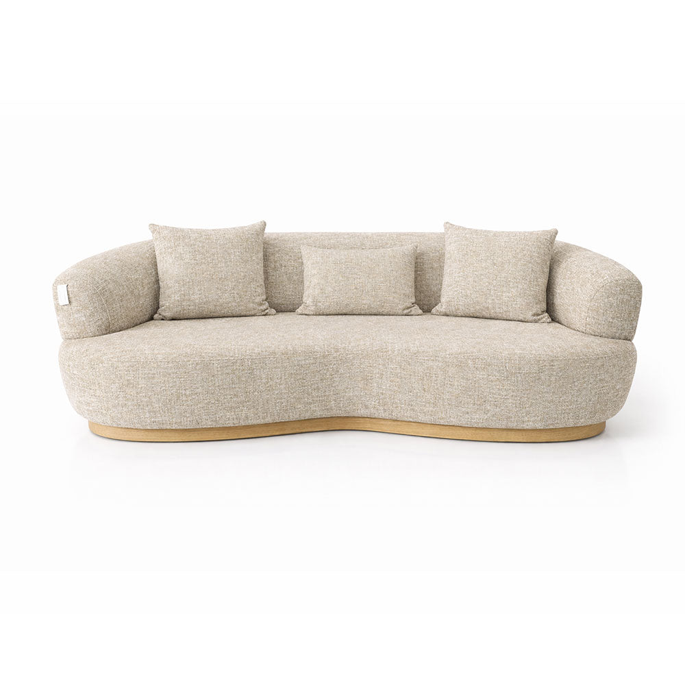 Modern curved 3 seater sofa upholstered in beige textured fabric, featuring a sculptural silhouette and comfortable deep seating ideal for contemporary living rooms.