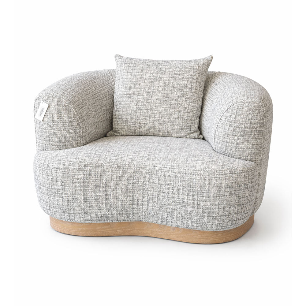Contemporary grey accent armchair with rounded arms and plush seating, offering comfort and refined modern style for lounge and living spaces.