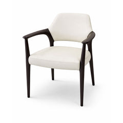Designer dining chair with soft cream leather upholstery and sculptural contrast legs, perfect for modern dining rooms and open-plan interiors.