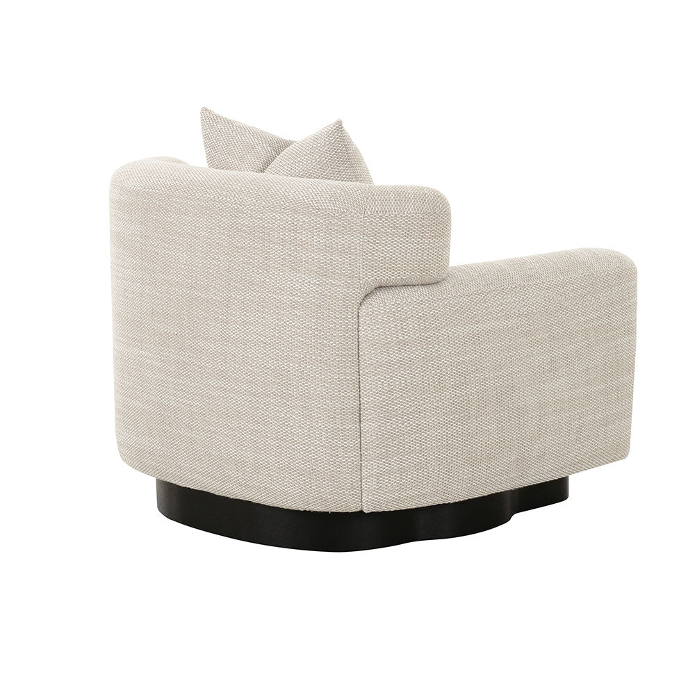 Stylish modern armchair with rounded side curves, slit-back design, and premium fabric finish, perfect for modern interiors.