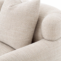 Comfortable and elegant accent armchair with woven fabric, sleek curves, and refined silhouette, ideal for reading corners or living spaces.