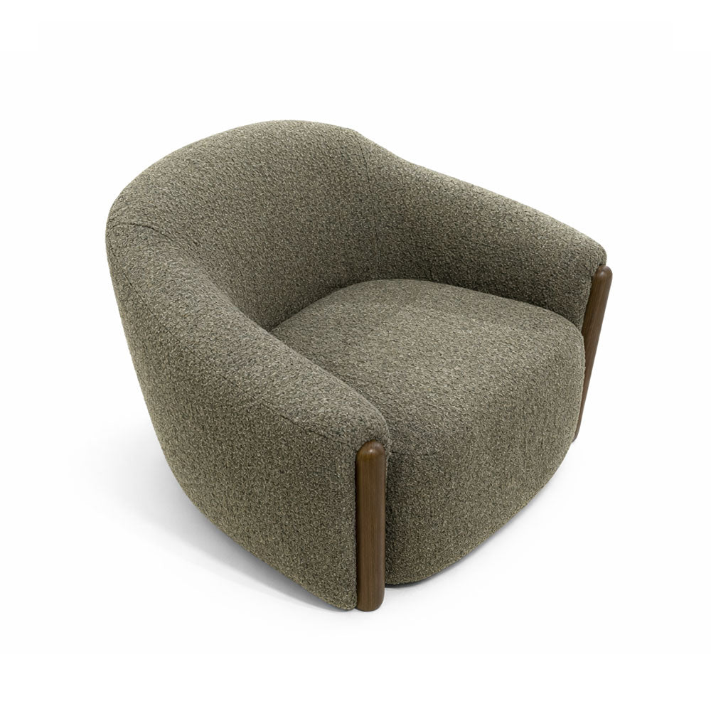 Comfortable designer armchair with textured olive green upholstery and wooden armrest detailing, perfect for living rooms, lounges, and modern interiors.