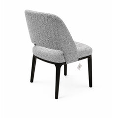 Refined grey upholstered dining chair with clean lines, subtle backrest detail, and durable dark-colored legs, ideal for stylish dining spaces.