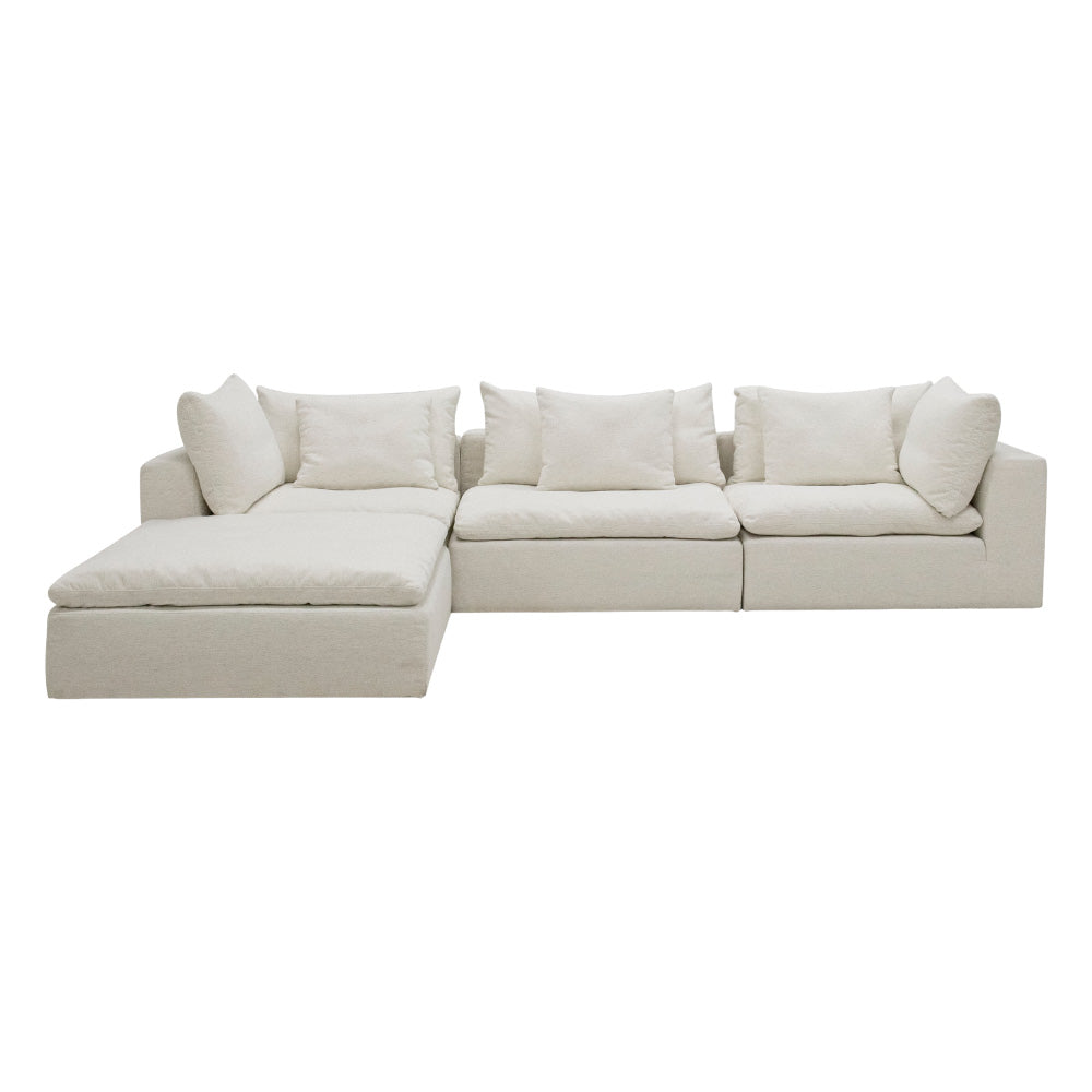 The Kali 4-Seater Sofa upholstered in premium woven fabric, featuring sleek lines, deep seats, and plush duck feather cushions, styled in a bright contemporary living room.