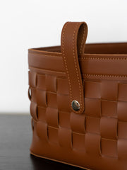 Elegant hand-woven green leather basket offering stylish and practical storage for living rooms, bedrooms, or offices, perfect for luxury and contemporary home décor.