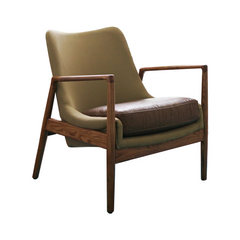Kiel Armchair featuring a top-grain leather seat, fabric upholstery, and sturdy wood frame, offering classic elegance and timeless comfort for living rooms or lounge spaces.