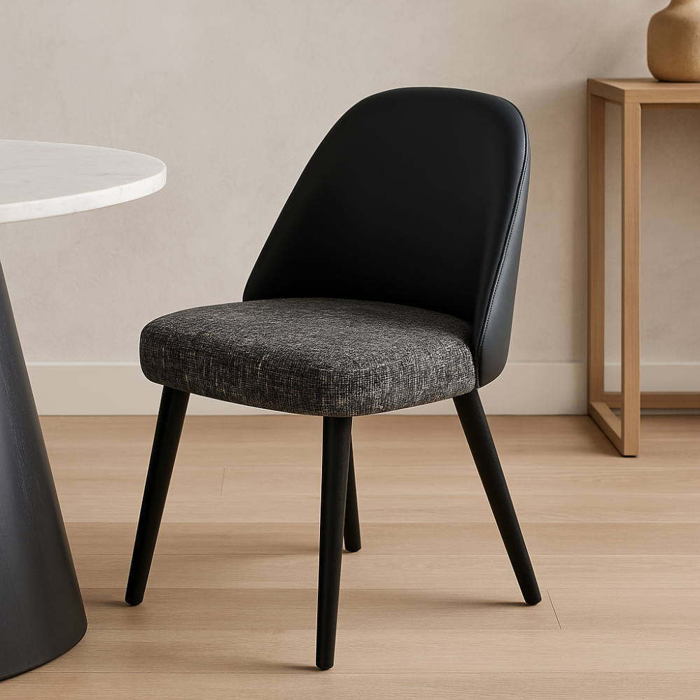 Stylish dining chair with fabric seat and leather backrest, placed in a modern dining room interior with marble table and wood console