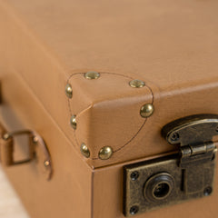 Tan leather-look storage box adding sophistication to any living space.