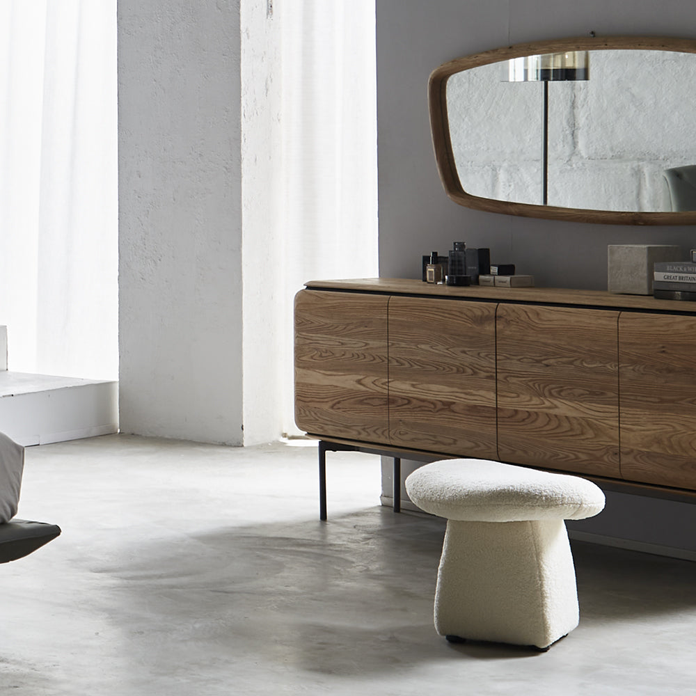 Contemporary ottoman featuring luxurious chenille fabric and sleek design for versatile seating or footrest use.