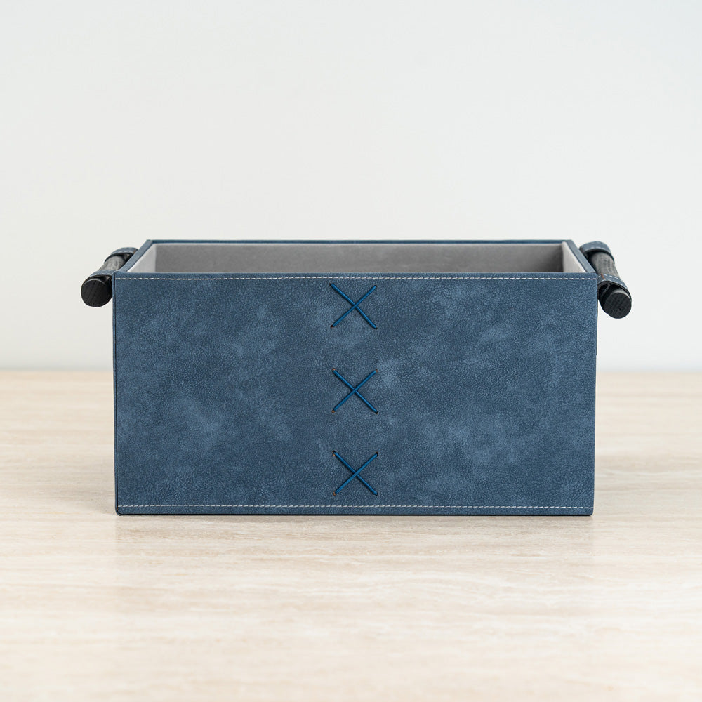 Lucan storage box in navy and cream with leather-look finish and convenient side handles.