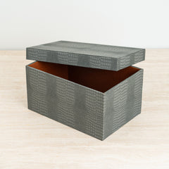 Blue croc-patterned jewelry storage box with luxe orange velvet inner lining