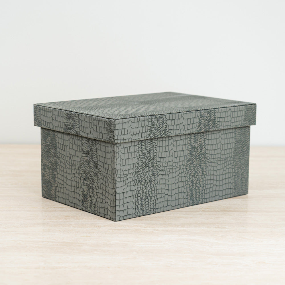 Chic accessory organizer featuring a crocodile-textured exterior and vibrant velvet interior.