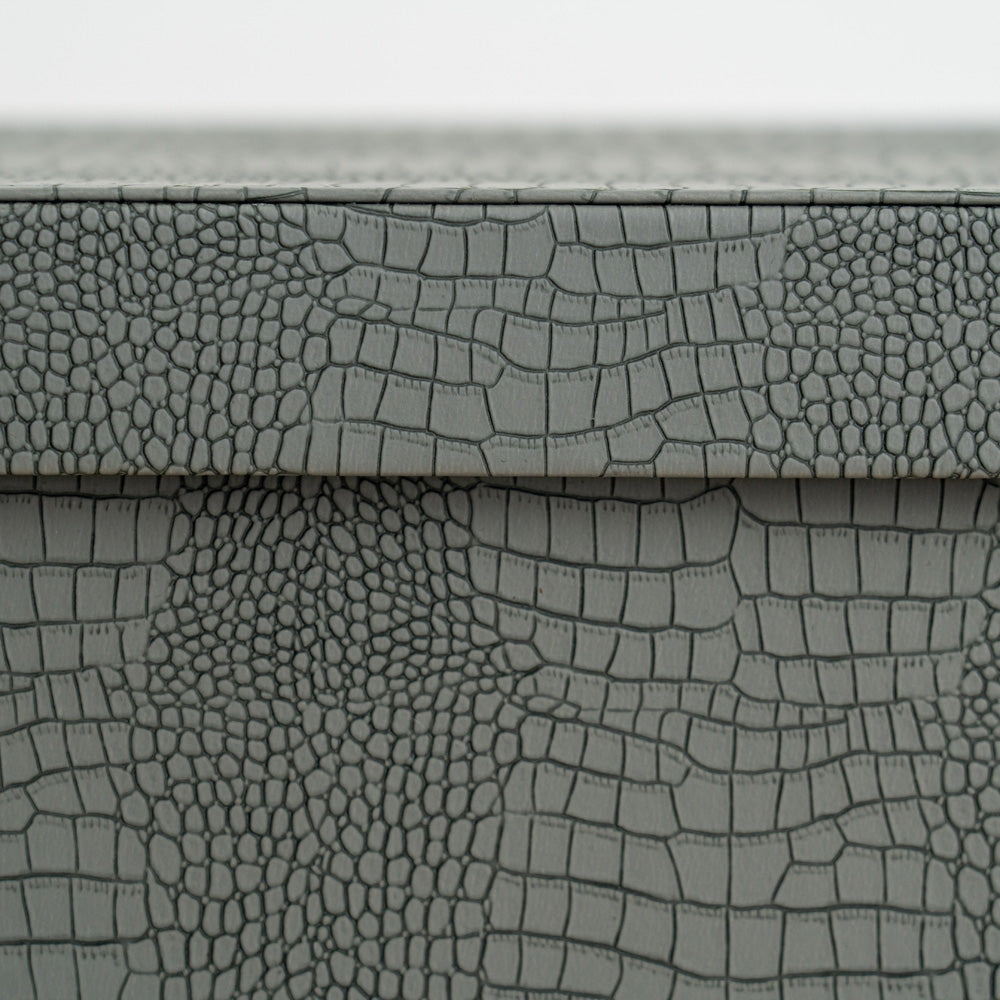 Designer storage box with crocodile finish and rich orange velvet interior for valuables