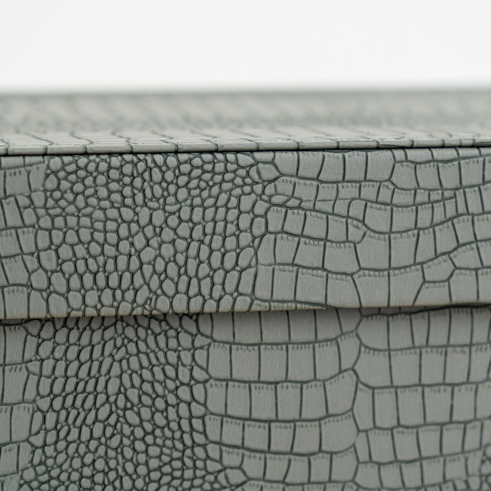 High-end storage chest with a blue crocodile exterior for watches, accessories, and keepsakes.