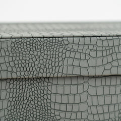 High-end storage chest with a blue crocodile exterior for watches, accessories, and keepsakes.