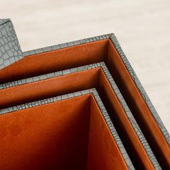 Premium storage box designed with a dusty blue crocodile finish and plush interior