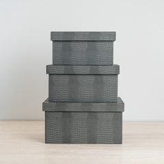 Blue crocodile jewelry box featuring a vibrant orange velvet interior for elegant storage.