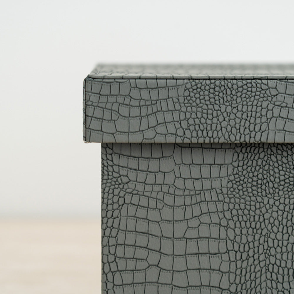 Designer storage box with crocodile finish and rich orange velvet interior for valuables